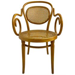 After Michael Thonet - bentwood armchair, circular cane seat and back, scrolled arms