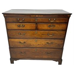 George III oak chest, rectangular top over frieze with inlaid with inscription panels 'Mary Rees' and fan motifs, frieze drawer over two short and three long graduating drawers, fitted with brass swan-neck handles and oval escutcheons, on bracket feet