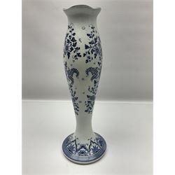 Pair of Delft blue and white vases, of elongated baluster form with shaped fluted rim, one depicting a Dutch sailing scene, the other a Dutch windmill scene, with painted mark beneath, H35.5cm