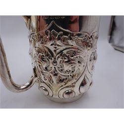 Late Victorian silver christening mug, with C handle and gilt interior, the body profusely embossed with floral and foliate decoration, hallmarked Atkin Brothers, Sheffield 1897, H10cm