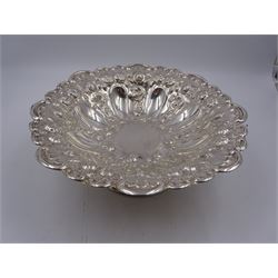 Edwardian silver pedestal bowl, of circular form, with shaped C scroll rim, embossed with floral and foliate decoration throughout, upon a circular foot, hallmarked Elkington & Co Ltd, Birmingham 1901, H9.5cm, D25cm