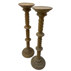 Pair of Victorian design light oak torcheres or jardinieres, circular top with raised lip over a spiral turned column terminating in circular turned plinth base