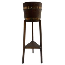 RA Lister & Co, Dursley - early 20th century oak jardinière plant stand, coopered barrel on three splayed supports united by undertier 