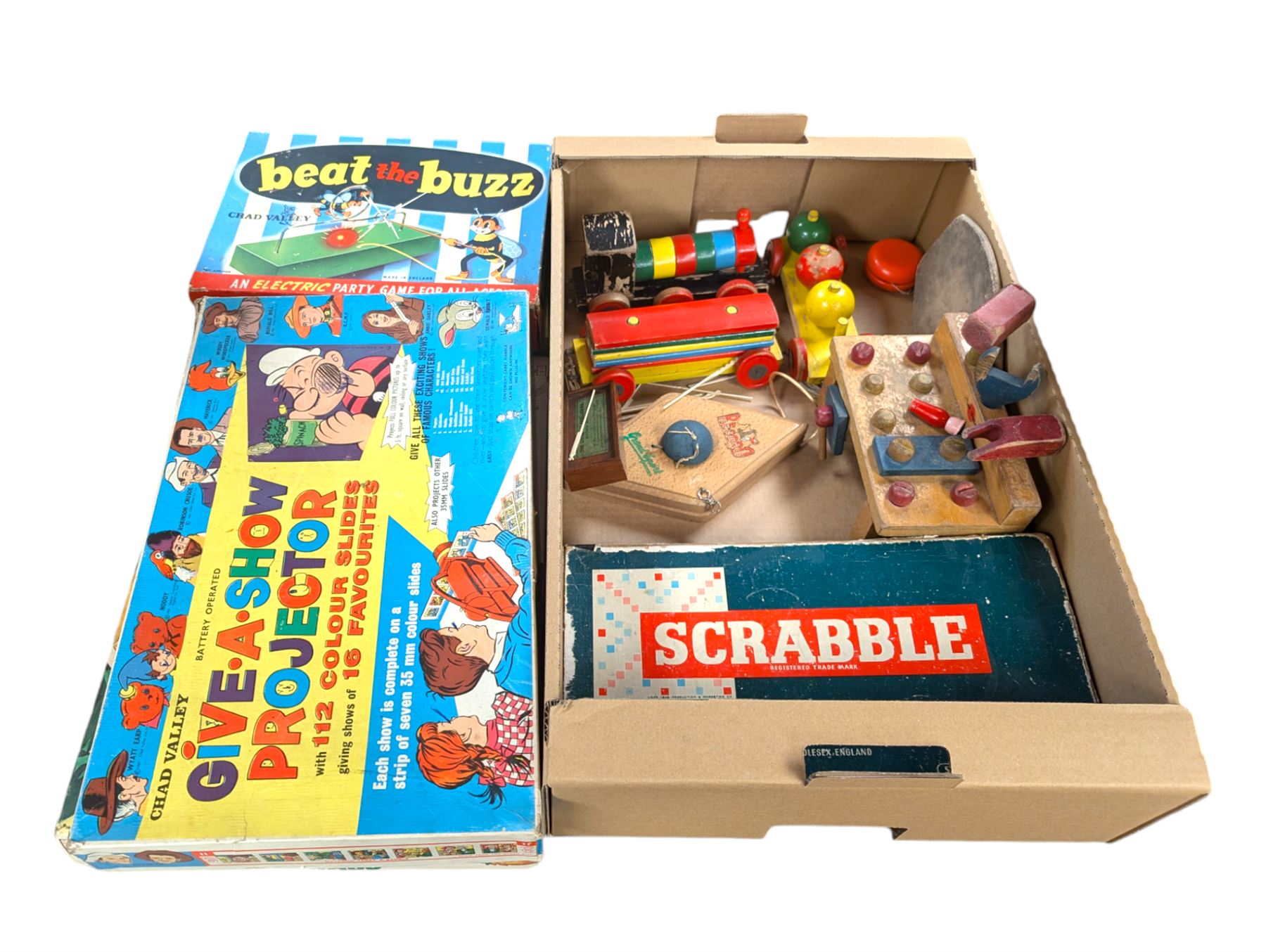 Chad Valley toys and games, including Give A Show projector and a wooden tool bench, together with other wooden toys, Lone Star Trail Boss cap gun and board games