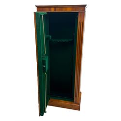 21st century steel lined gun cabinet, modelled as a Wellington chest of yew wood, to hold six long guns, interior lined with green baize, three storage shelves, with keys and bolts 