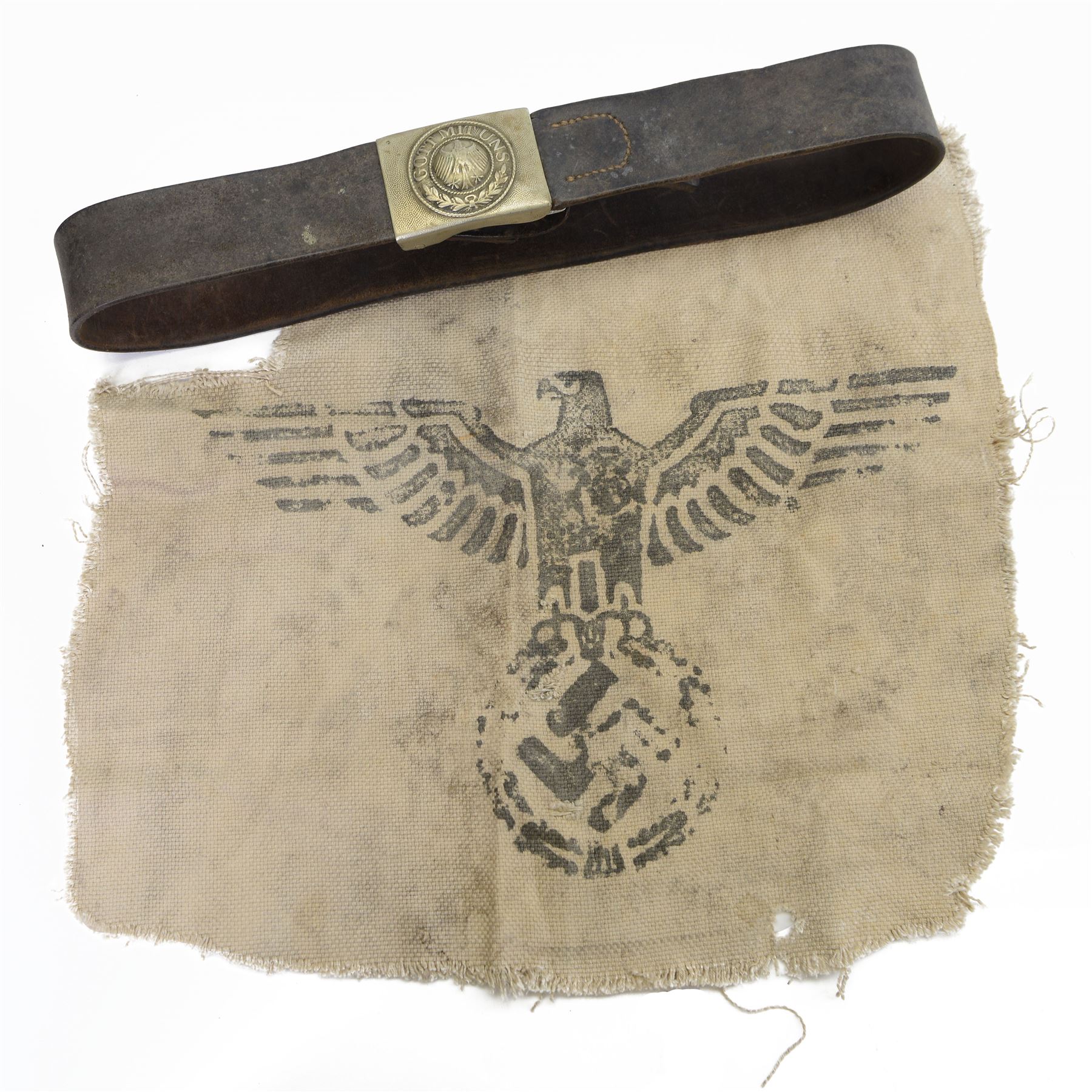 WWII German army die struck belt buckle 'Gott Mituns' with brown leather belt, together with piece of canvas from a german wagon, marked with the form of army eagle with swastika 