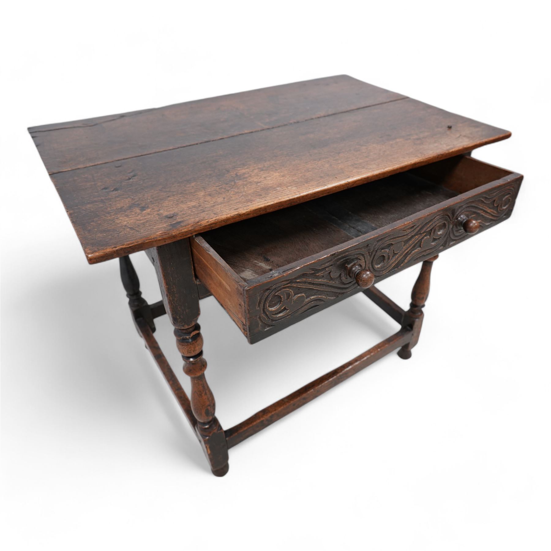 18th century oak side table, rectangular pegged two-plank top over singe drawer carved with S-scrolls, on turned supports united by plain stretchers 