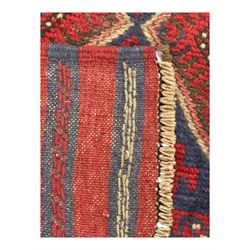 Pashtun Meshwani ground runner, central field decorated with rows of multicoloured diamond medallions, surrounded by geometric motifs, wide red and blue striped border with additional guard bands