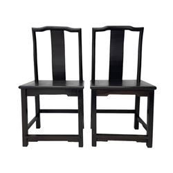 Pair of early 19th century Chinese Qing dynasty black wood side chairs, yoke cresting rail over shaped back panel, panelled rectangular seat on square supports united by stretchers 