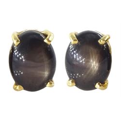 Pair of gold black / brown star sapphire stud earrings