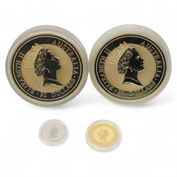 'The Aussie Australia's Diversified Precious Metal Portfolio' comprising two one kilogram fine silver kookaburras, two ounce fine gold kangaroo nugget and one ounce fine platinum koala, housed in a green plastic display case with certificates