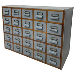 Mid-20th century multi-drawer chest or filing cabinet, fitted with twenty-five small drawers with wooden handles and metal label holders, in light blue paint finish 