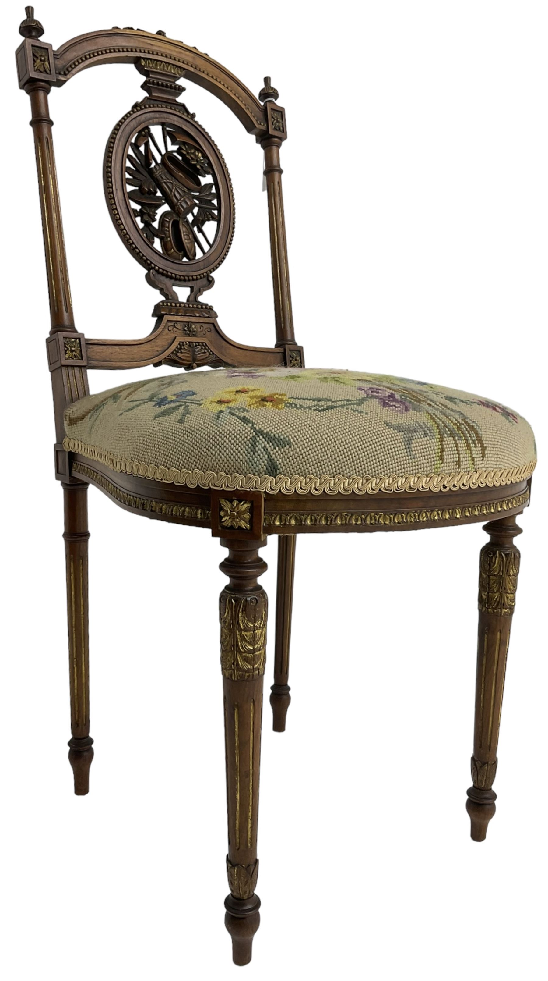 Late Victorian walnut side chair, arched cresting rail over carved and pierced splat depicting baskets and foliage, floral needle work upholstered seat, on acanthus carved and fluted turned supports