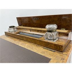 Late Victorian figured walnut davenport, raised pen and ink compartment over hinged sloped lid, four working drawers to right hand side, compressed turned bun feet with recessed castors