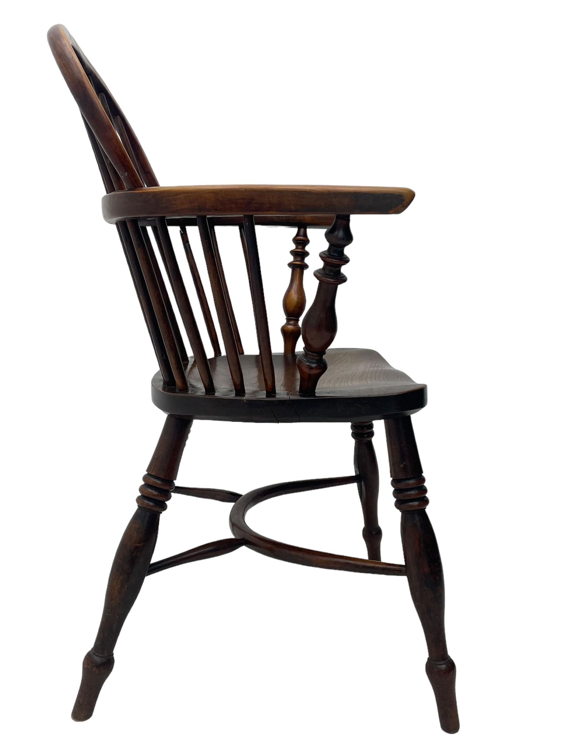 19th century yew wood and elm Windsor armchair, low double hoop stick and pierced splat back, dished seat on turned supports united by crinoline stretchers