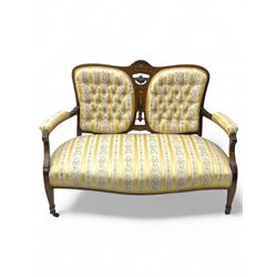 Edwardian rosewood two-seat settee, shaped back with inlaid decoration and carved crest, u...