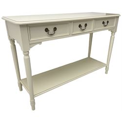 Laura Ashley - 'Clifton' ivory finish three drawer console table, fitted with three frieze drawers with heavily moulded edges, raised on turned supports united by undertier