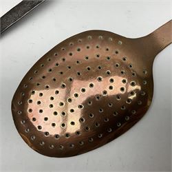 Large 19th century copper slotted spoon, with pierced flat bowl, L55cm, together with two 19th century iron handled ladles with circular copper bowls, largest example L48.5cm, (3)