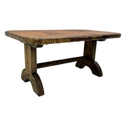 Rectangular oak coffee table, rectangular top with tan leather cover decorated with naturalistic scene, on rectangular end supports and curved feet united by turned stretcher 