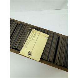 Collection of magic lantern slides, predominantly depicting views of India, with scenes including including the Taj Mahal, tombs, monuments, street scenes, people and animals, in compartmentalised wooden case 