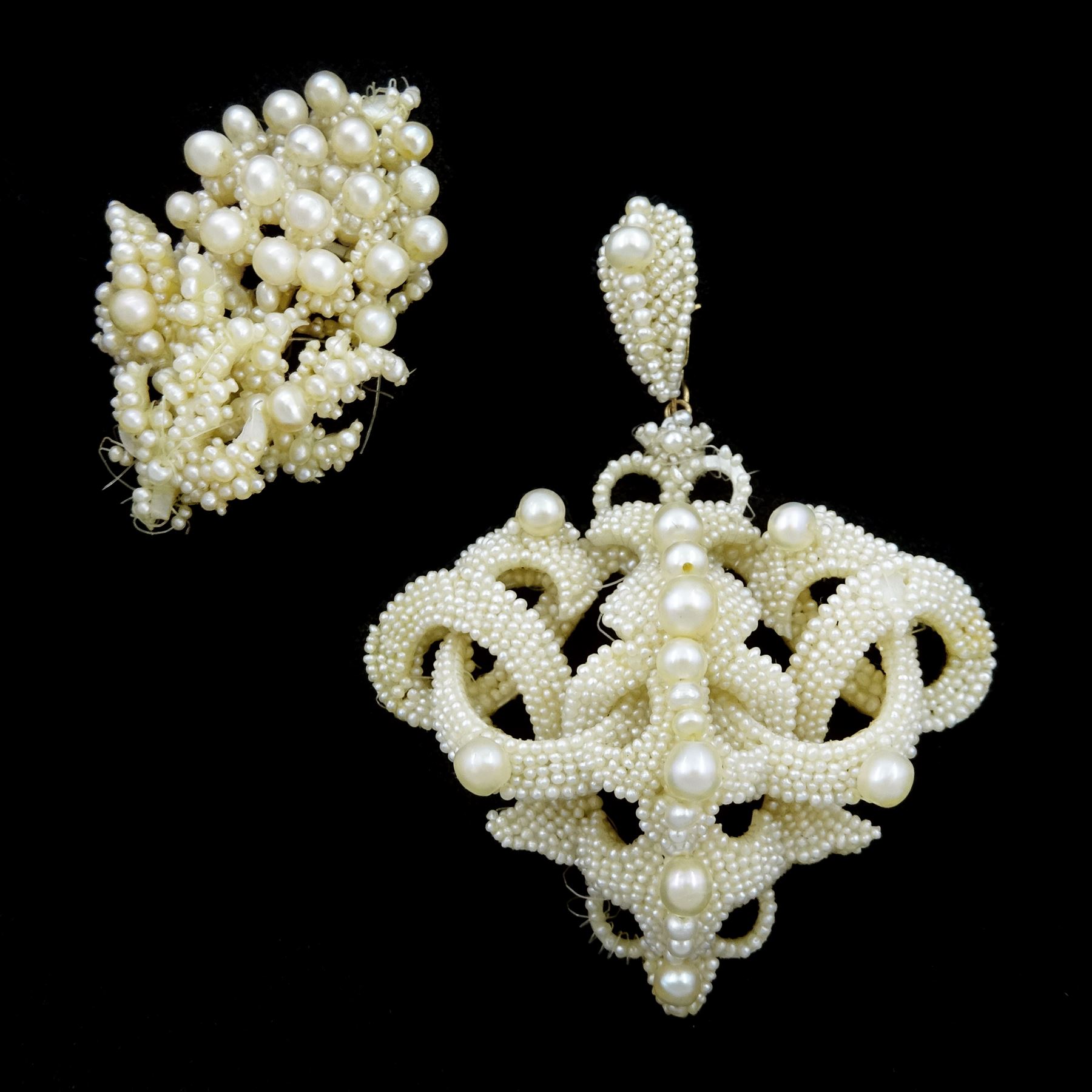 19th century seed pearl knot pendant brooch, of scrolling knot design suspended from a detachable matching bail, mounted to mother of pearl backing, together with a section designed as a bunch of grapes (2)