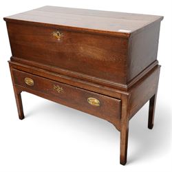 Late 18th century oak blanket box on stand, the box with hinged lid enclosing vacant interior, the stand fitted with single drawer, on square tapering supports 