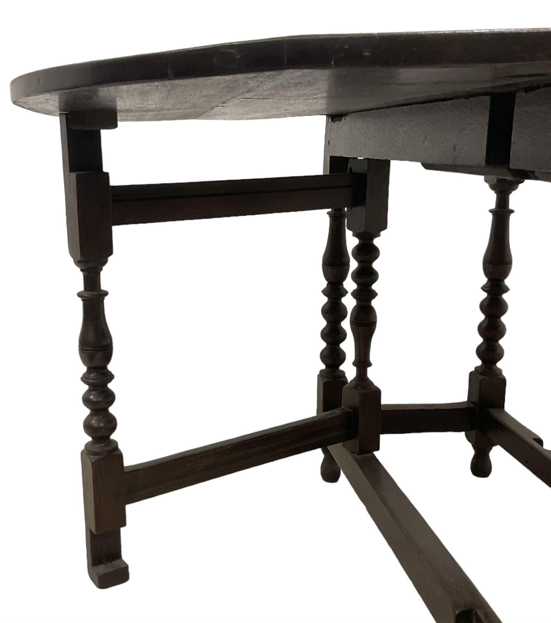 18th century country oak drop-leaf table, oval top, fitted with single drawer, raised on double gate-leg action bobbin-turned supports, united by stretchers