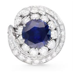 Platinum Ceylon sapphire and diamond, swirl design cluster ring, round cut sapphire of 4.56 carat, with CGL report, with baguette and round brilliant cut diamond surround, total diamond weight approx 4.30 carat