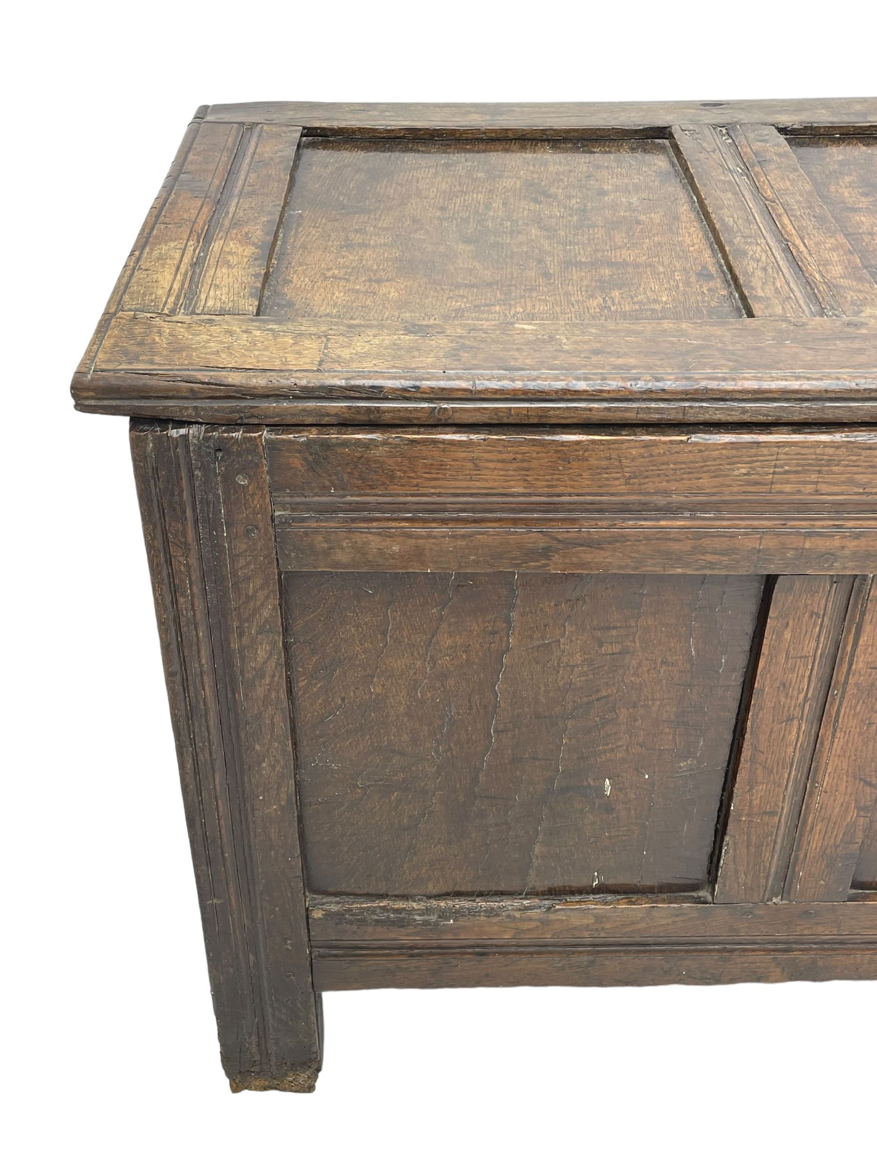 17th century panelled oak blanket chest or kist, quadruple panelled hinged lid over quadruple panelled front, moulded frame and pegged construction, on stile supports