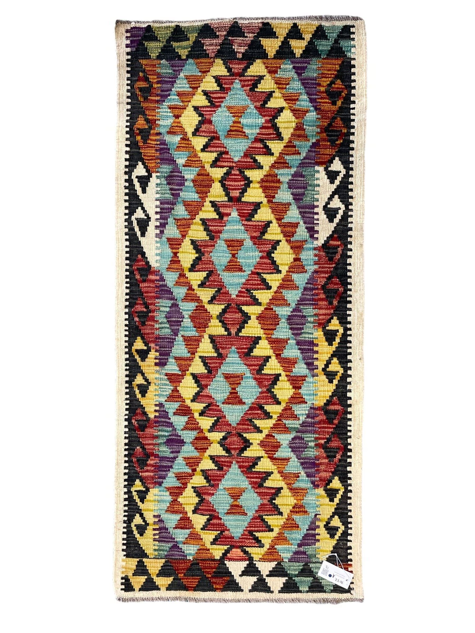 Chobi Kilim ivory ground runner rug, the field decorated with four multi-coloured lozenges, each with central geometric decoration, within concentric lozenges, enclosed by hooked border