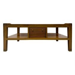 Starbay Tobago cherry wood coffee table, rectangular top with two inset glass panels, central drawer with louvred front and brass handles, flanked by open shelving, raised on square supports with metal corner brackets