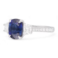 Platinum three stone oval cut sapphire and half moon cut diamond ring, with diamond set shoulders, hallmarked, sapphire 2.73 carat, total diamond weight approx 1.10 carat