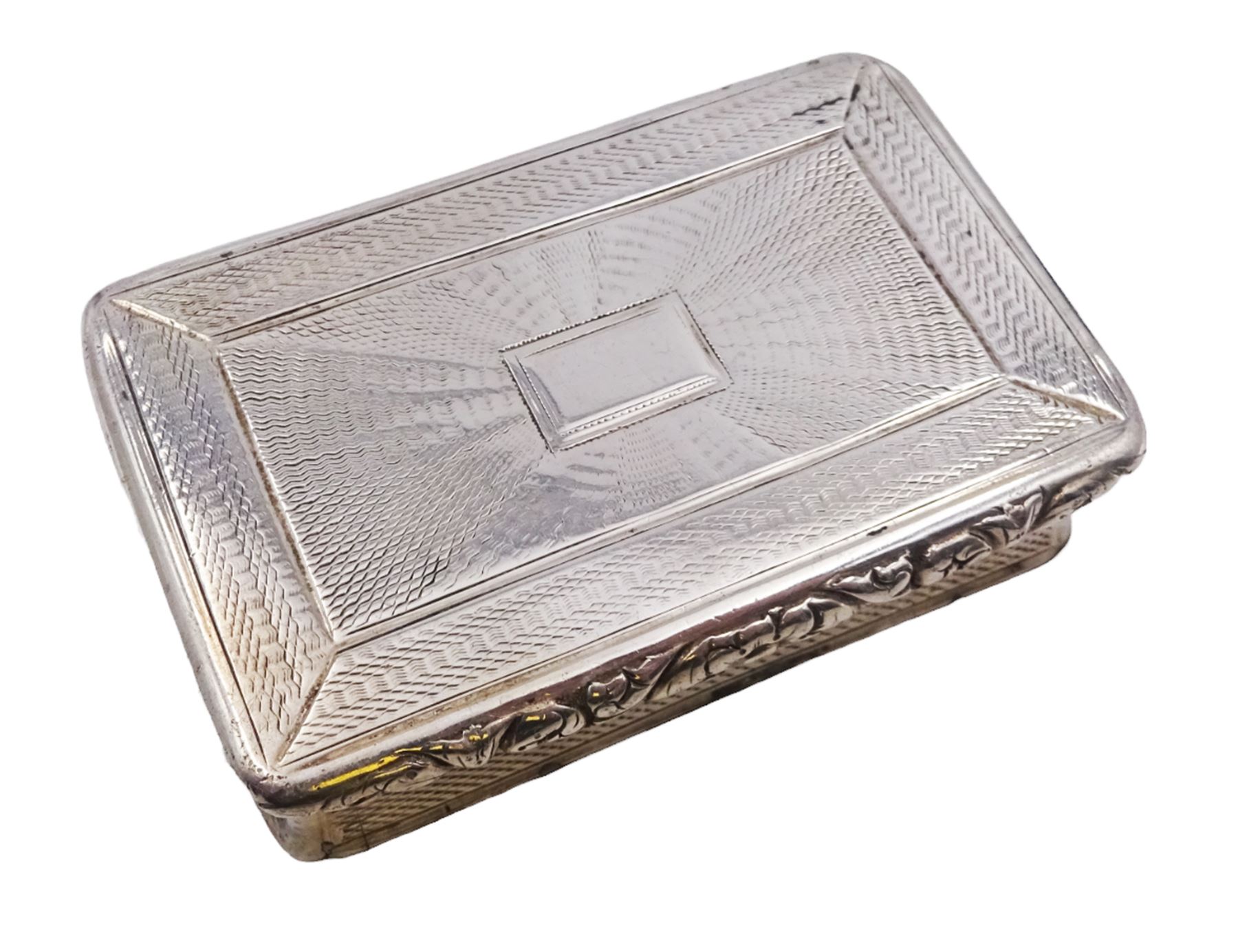 George IV silver snuff box, of rectangular form, with engine turned decoration, chased foliate borders and blank cartouche to centre of hinged cover, opening to reveal a gilt interior, hallmarked John Bettridge, Birmingham 1825, W7.6cm