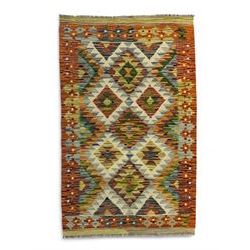 Chobi Kilim multi-coloured rug, the busy field decorated with all-over lozenges of contrasting colour, the guard lines decorated with further geometric designs