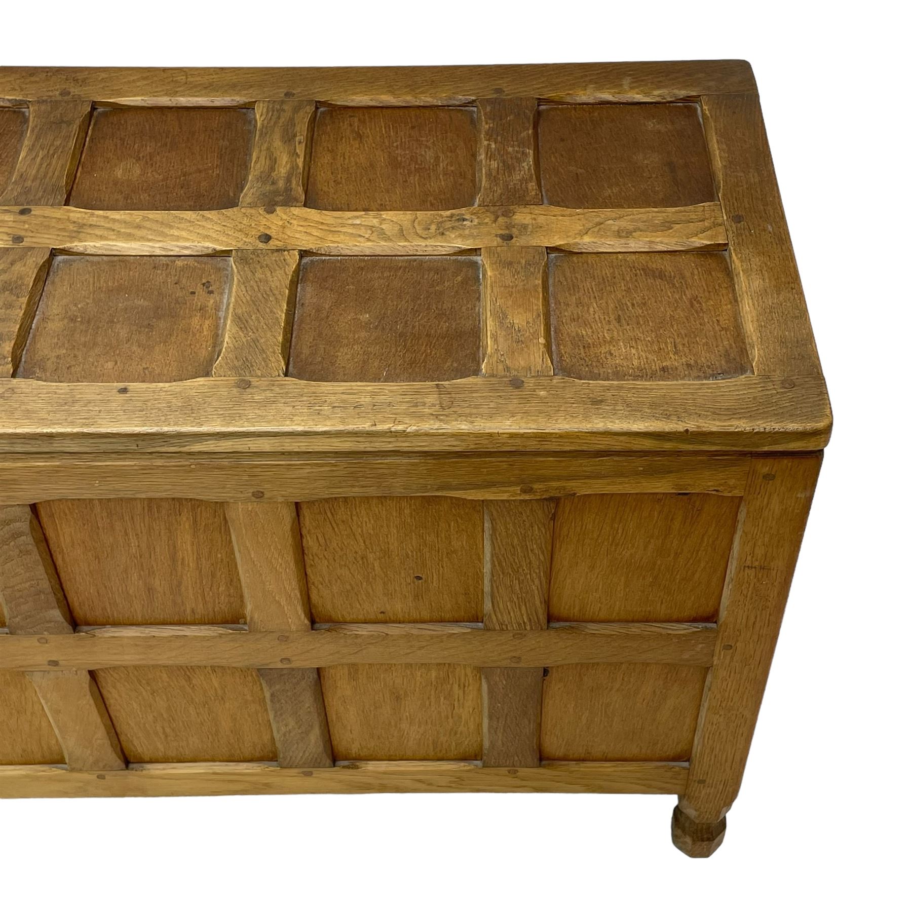 Sid Pollard (ex. Mouseman) - Yorkshire oak blanket chest, all over panelling, enclosed by hinged lid, on octagonal feet, interior plaque inscribed 'S. Pollard, Bagby, Thirsk, Yorks' 