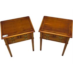 Pair of yew wood lamp tables, each fitted with three drawers
