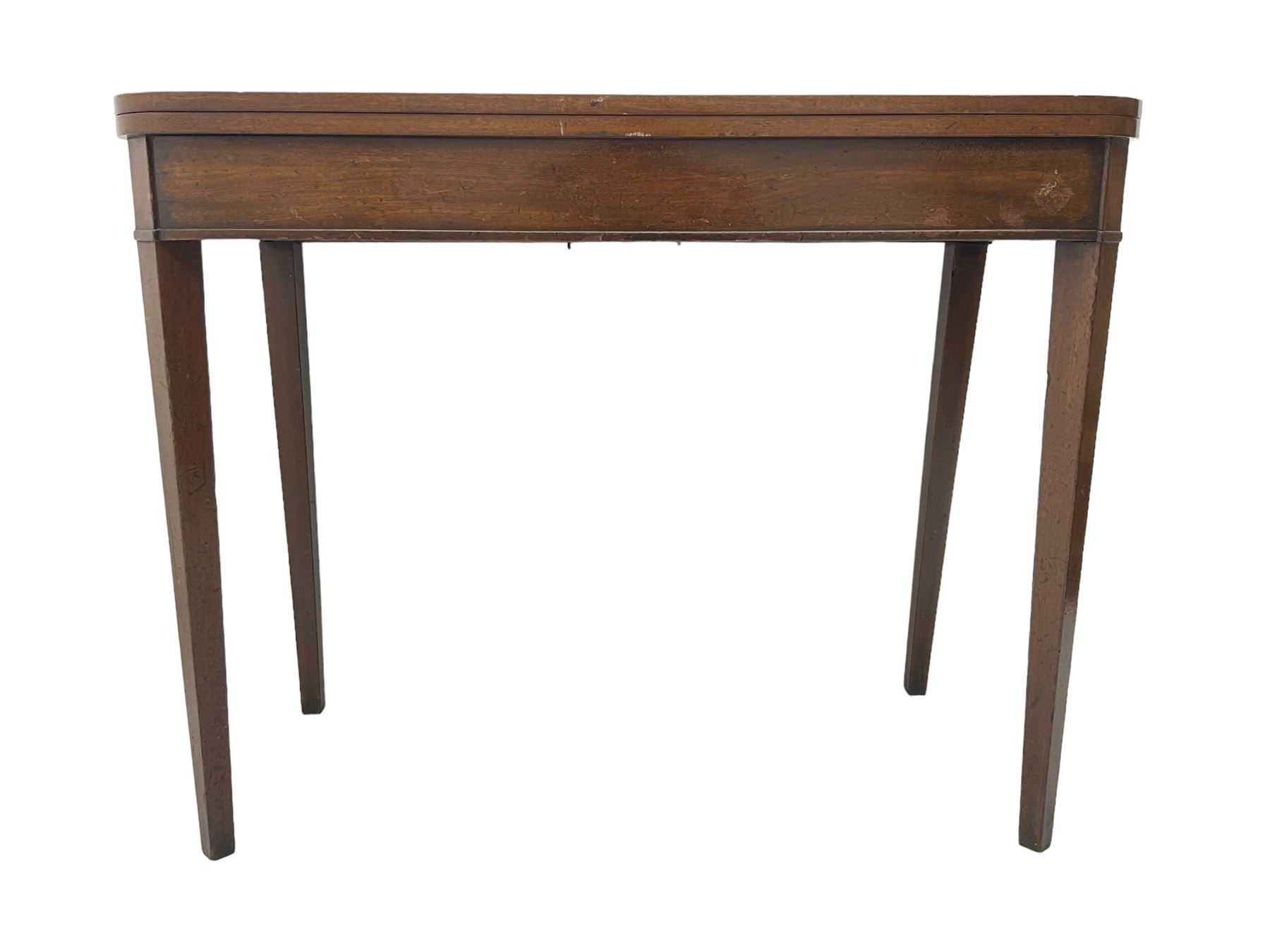 Early 20th century mahogany tea table, fold-over swivel top with rounded corners, raised on square tapering supports