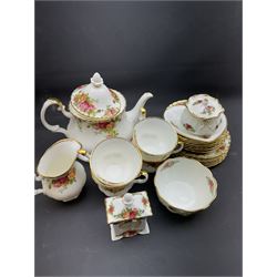 Royal Albert Old Country Roses tea service for six, comprising teapot, milk jug, open sucrier, cups and saucers, dessert plates, two trinket dishes covered jar and clock