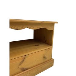 Pine television media unit, rectangular top with moulded edge, over open compartment and single drawer, on plinth base