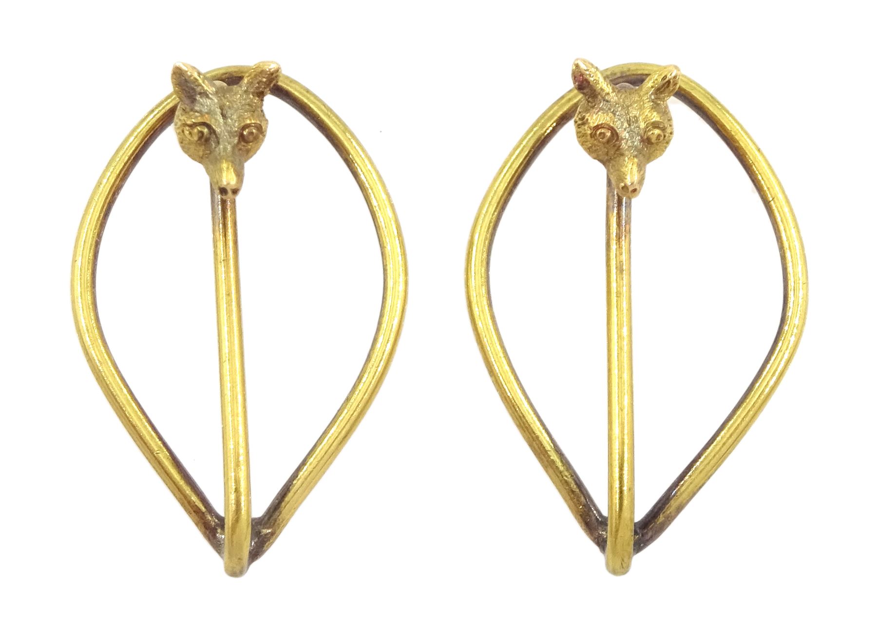 Pair of early 20th century 15ct gold fox head tie clips, stamped 15