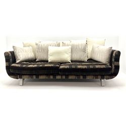 Grande four seat sofa upholstered in patterned fabric with contrasting scatter cushions 