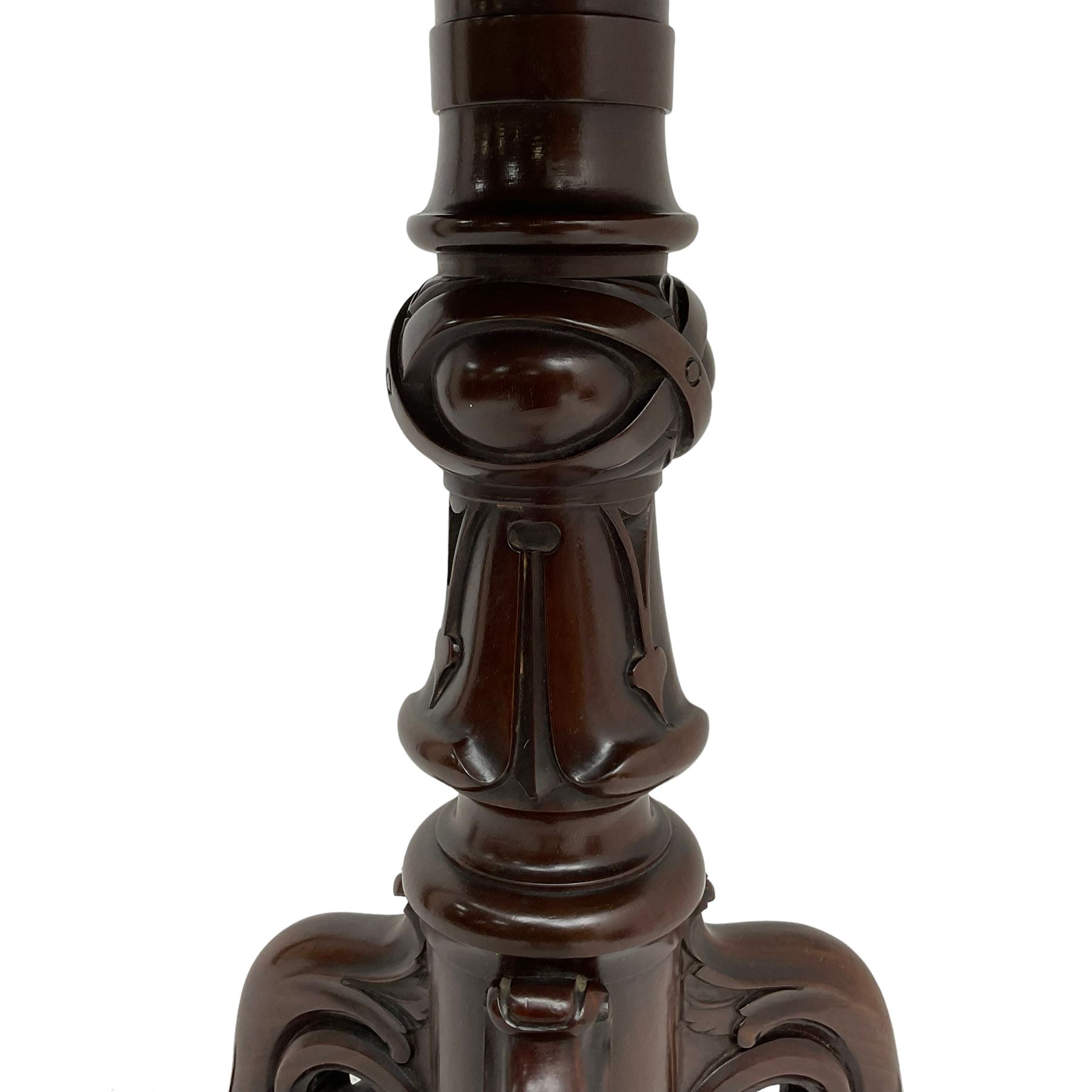 Victorian figured mahogany tripod table, octagonal top with segmented highly figured veneers over pointed arch frieze rails, on turned egg and dart carved pedestal with lappet carved baluster, three splayed and C-scroll carved supports with scrolled terminals