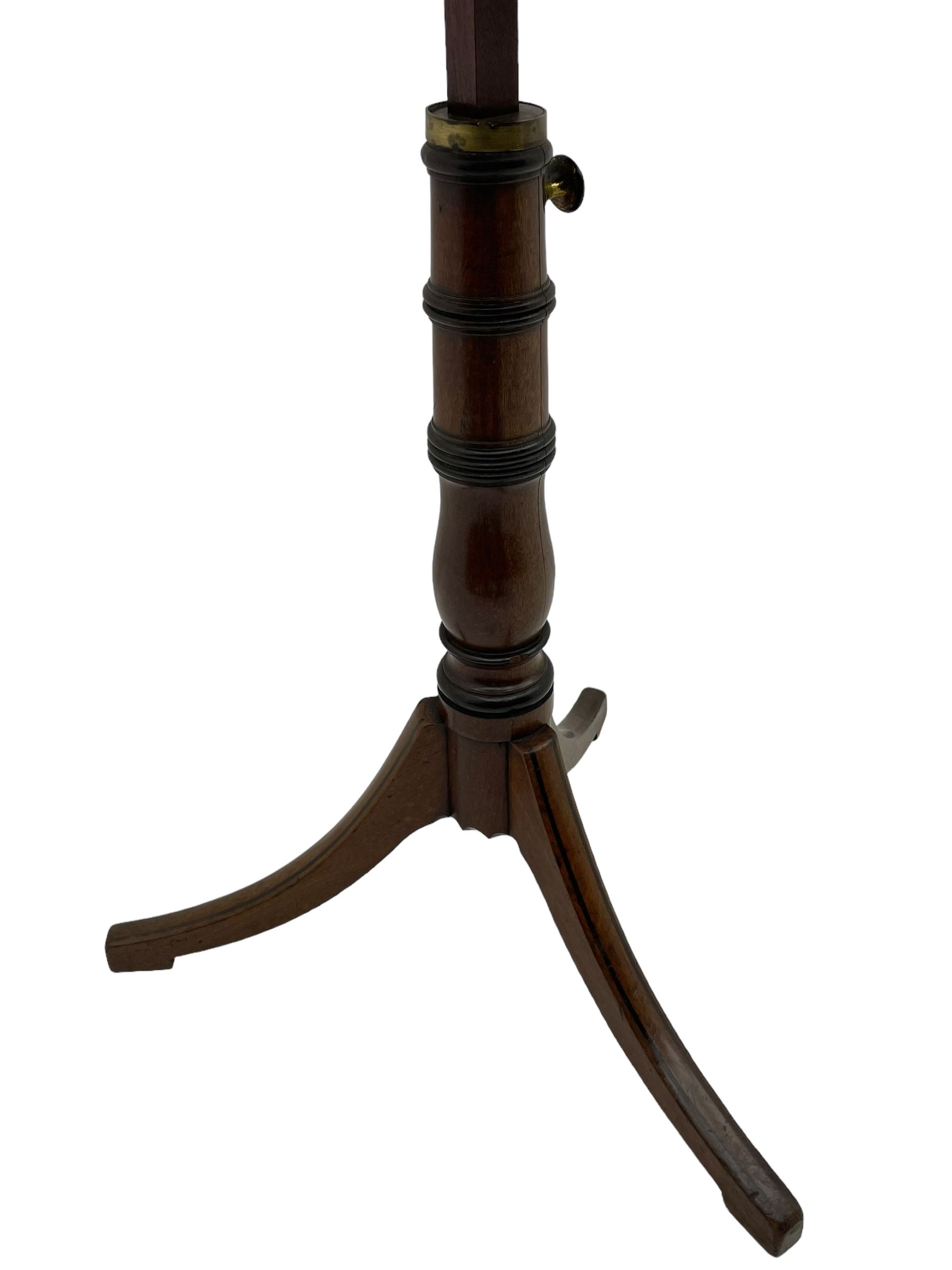 Regency mahogany reading stand, rectangular top with rounded corners on adjustable hinged mechanism, collar turned column on three out-splayed supports, inlaid with ebony stringing 