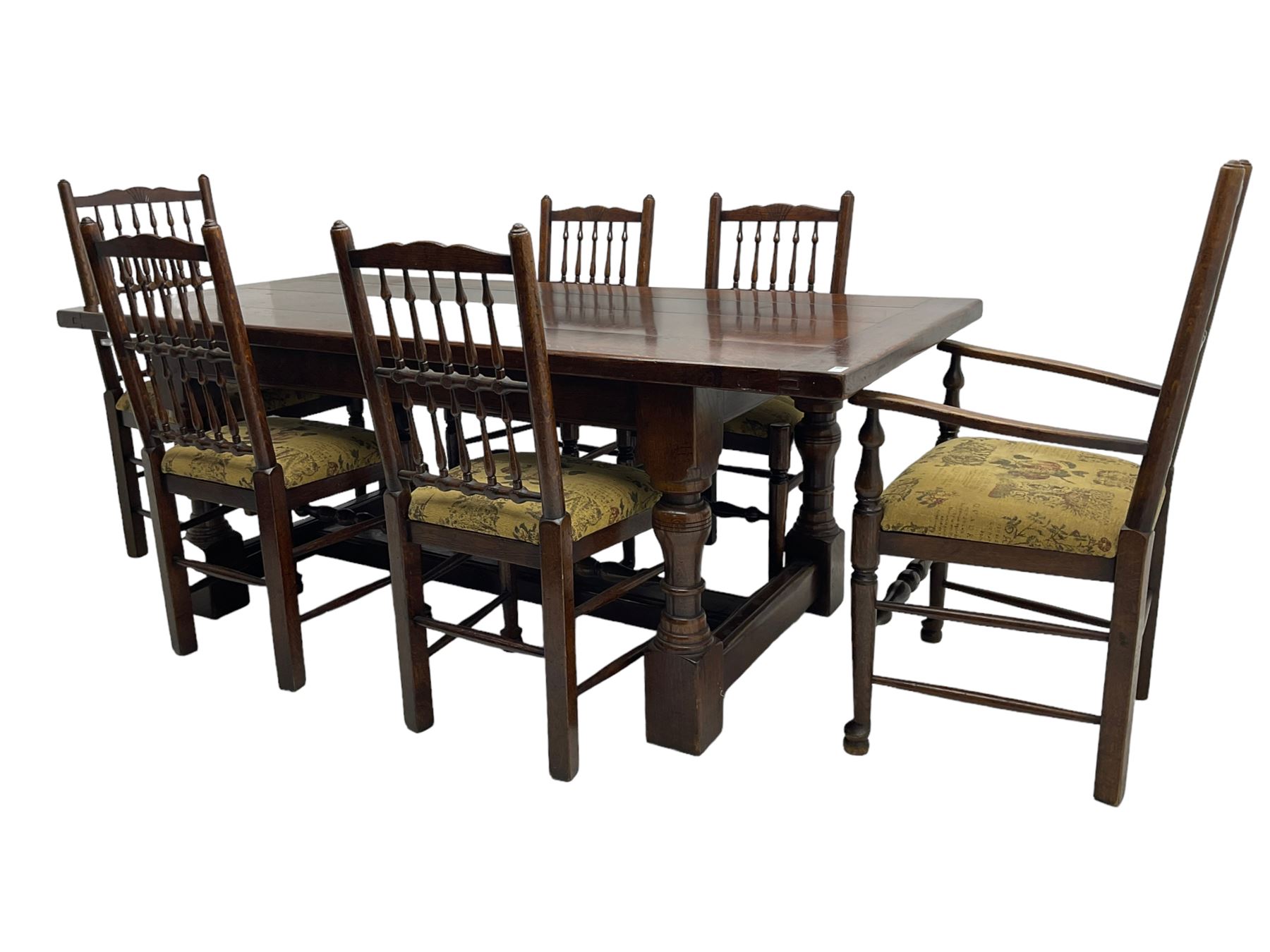 Oak refectory dining table, rectangular cleated top on turned supports joined by H-stretcher; together with set of six (4+2) oak spindle back dining chairs, with upholstered drop-on seat cushions, turned supports joined by turned stretchers