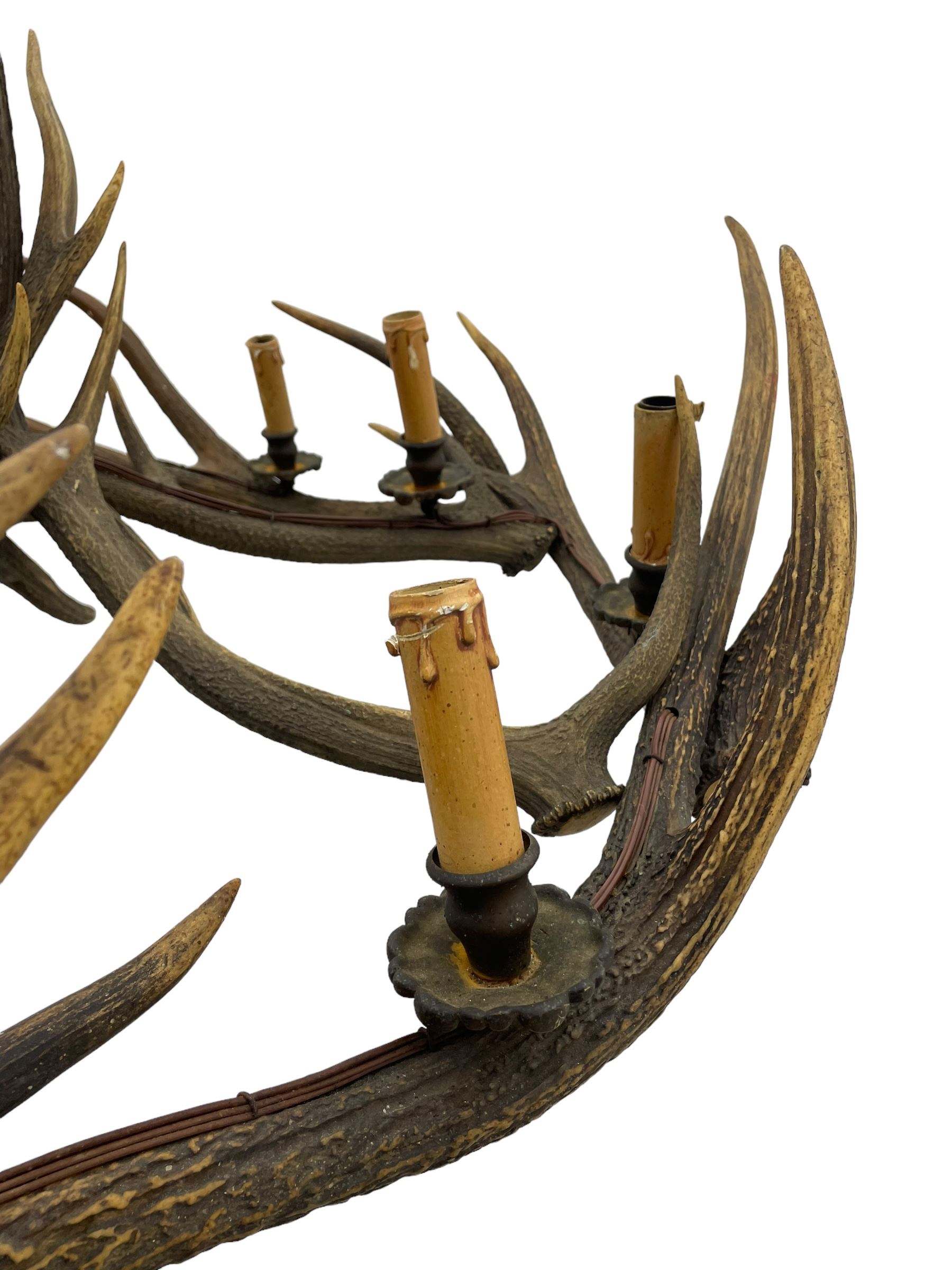 Deer antler chandelier, of circular shaped form, with nine fitted lights, D84cm, H65cm