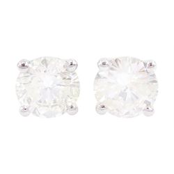 Pair of 18ct white gold round brilliant cut diamond stud earrings, stamped 750, total diamond weight approx 1.05 carat