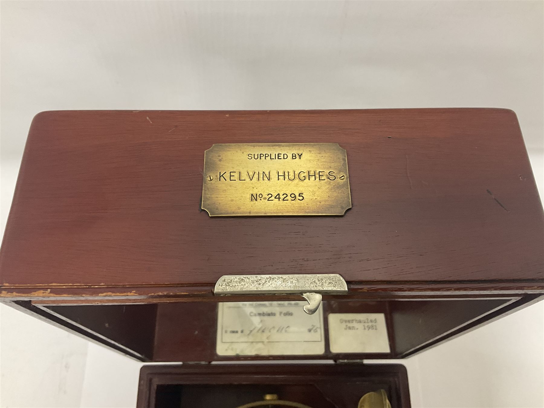 Two-day marine chronometer, with silvered dial inscribed Thomas Mercer Ltd, St Albans, contained within a brass gimbal-mounted bowl and glazed mahogany case, with applied brass plaque reading 'supplied by Kelvin Hughes no. 24295', brass winding key and two service notes to interior of case, dial D12cm, wooden case H17.5cm 