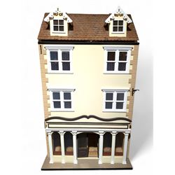 1:12 scale wooden four-storey dolls house with glazed shop front, with brick effect exteri...