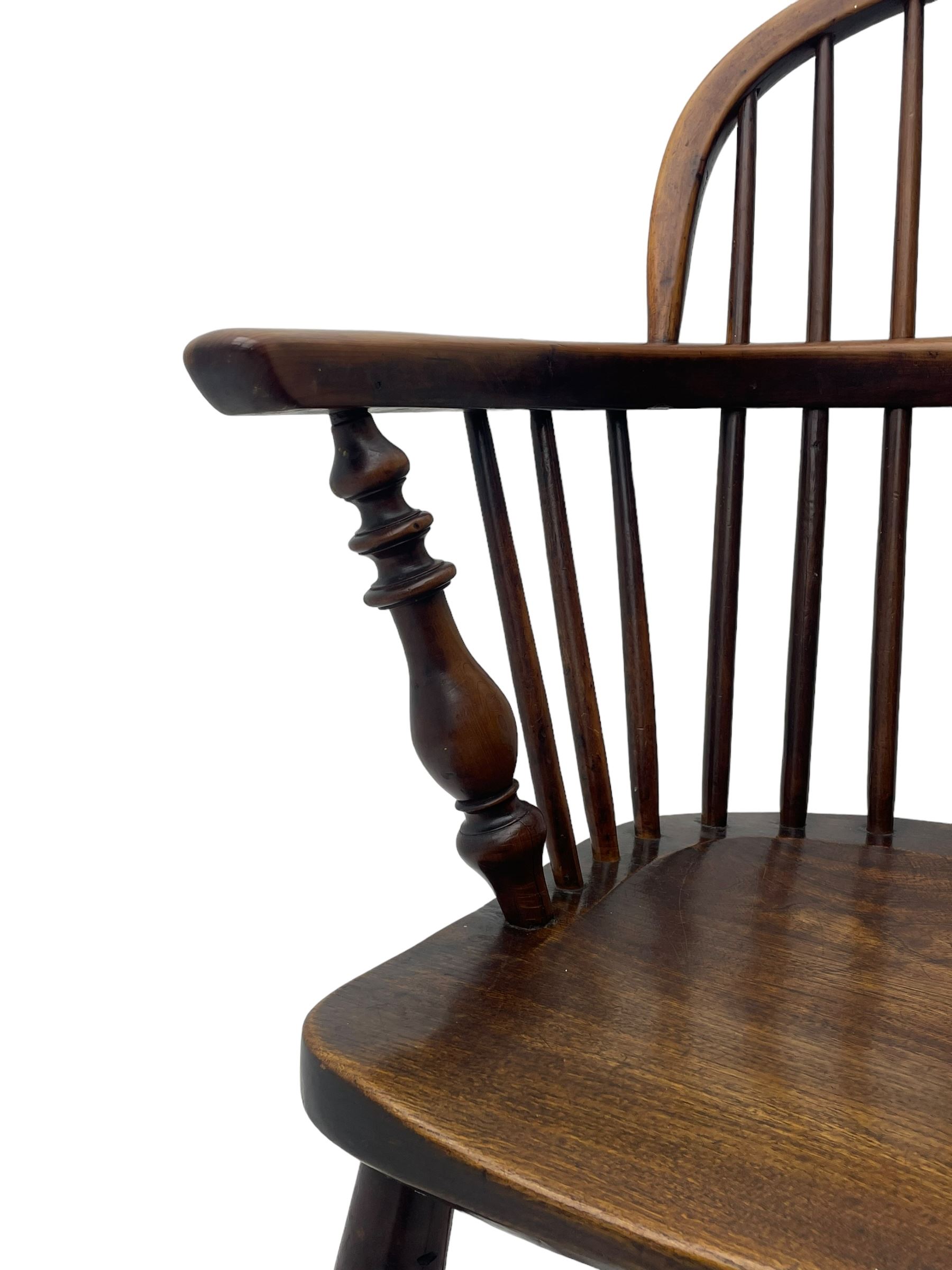 19th century yew wood and elm Windsor armchair, low double hoop stick and pierced splat back, dished seat on turned supports united by crinoline stretchers