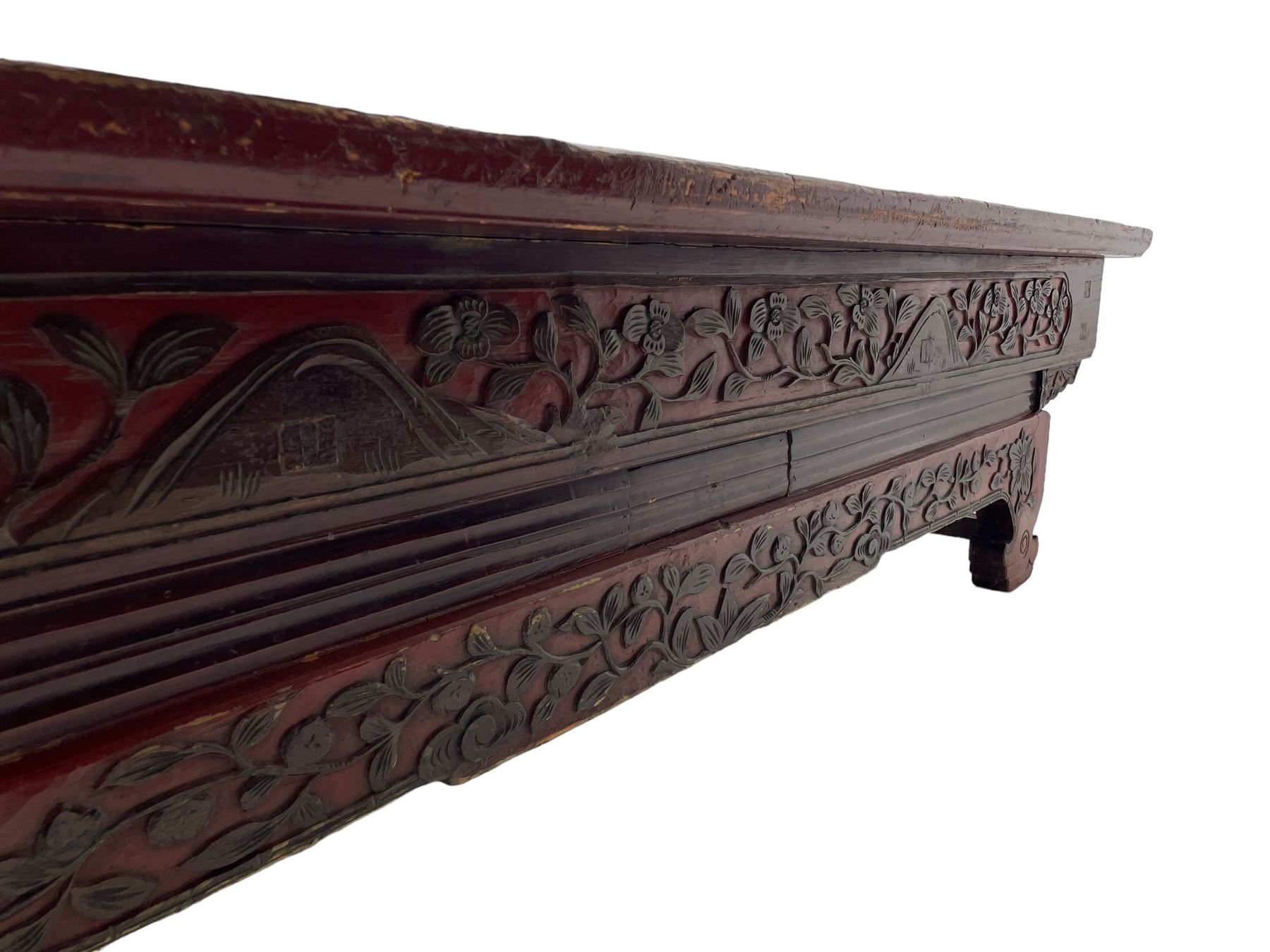 Mid-19th century Qing dynasty opium or wedding bed, Zhejiang province, rectangular top with weave cane work, the frieze rail carved with trailing leafy branches and flower heads, over moulded rail with small drawer, shaped base carved with further tailing foliate decoration terminating to shaped feet, united by stretchers 